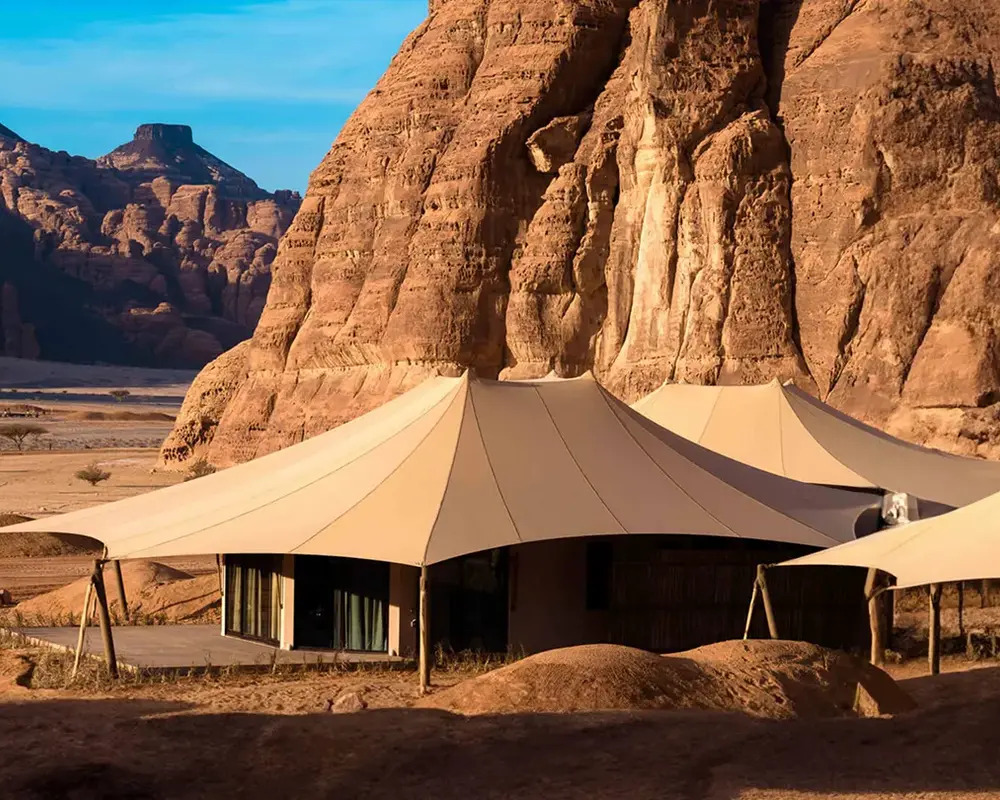 Golden desert rock formations of AlUla Saudi Arabia at warm golden hour